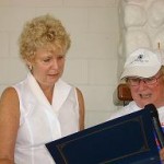 Susan Fletcher, Town of Danvers, accepts ADA Recognition Certificate from Mary Margaret Moore